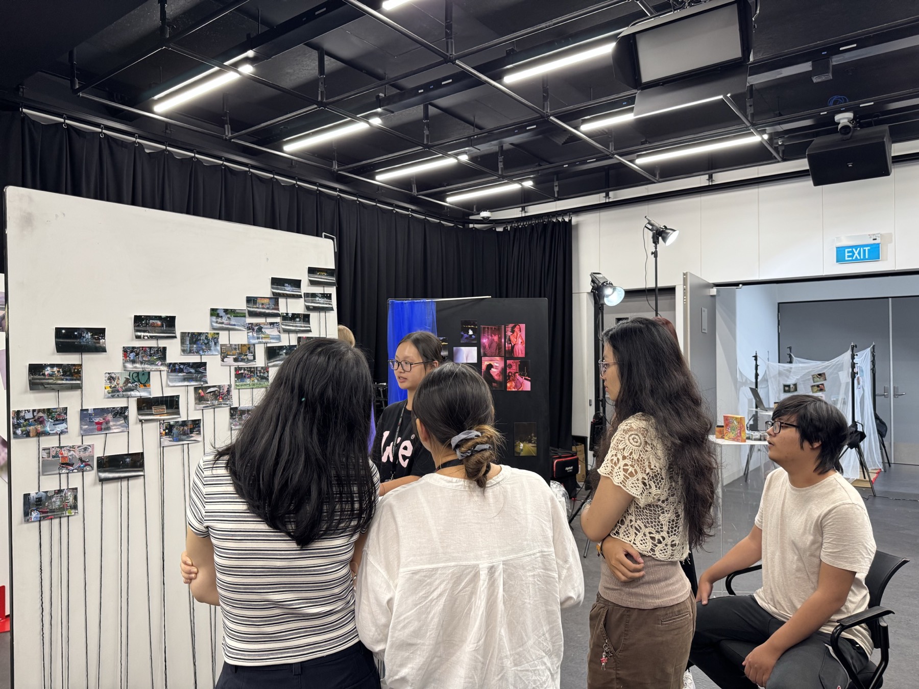 Visitors viewing wall displays of photographic prints