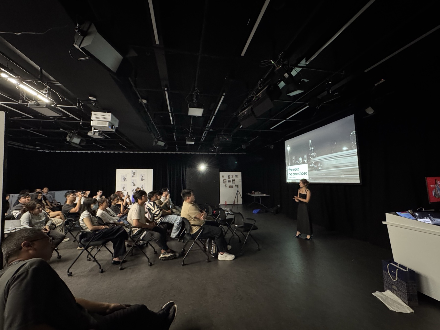 Audience seated for a presentation during the exhibition