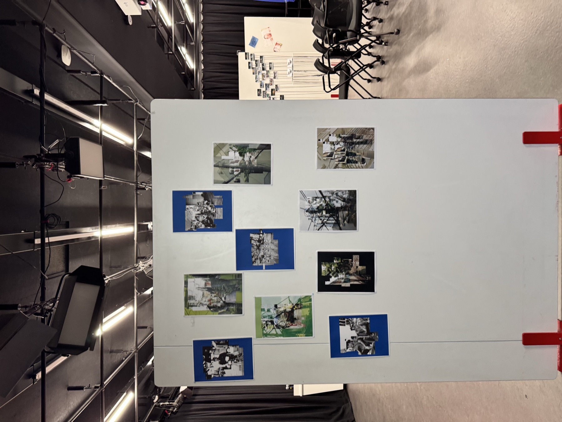 A white board covered with a montage of small prints